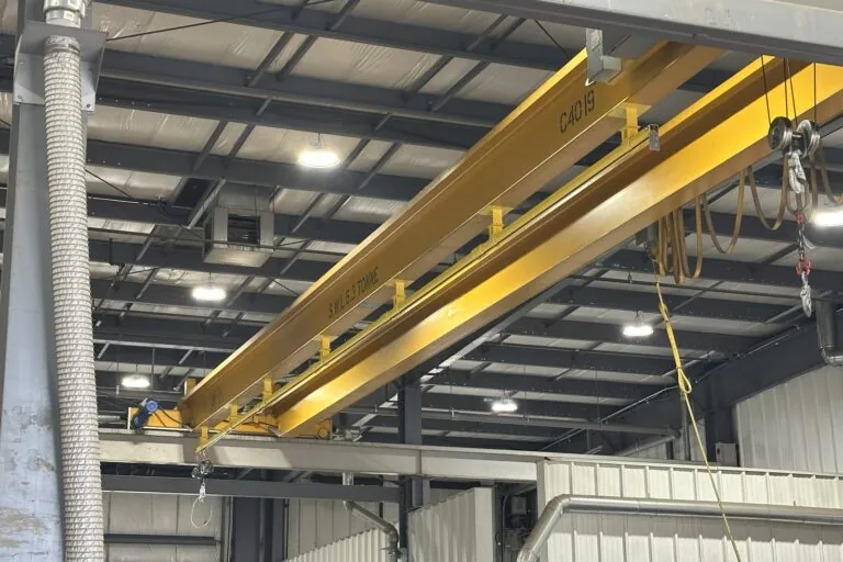 The rigid rail running the length of the service bay, with the crane girder above it.
